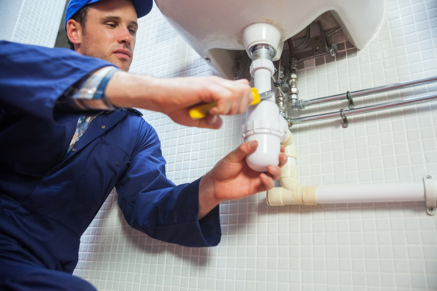 plumber repairing sink